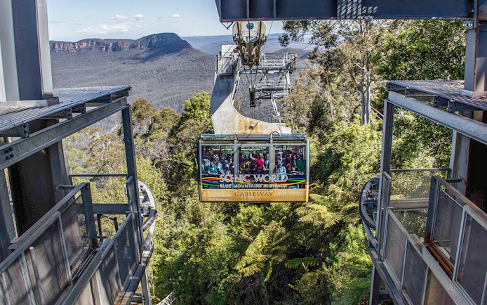 Cableway ride at Scenic World, Blue Mountains with forest and cliffs in view.