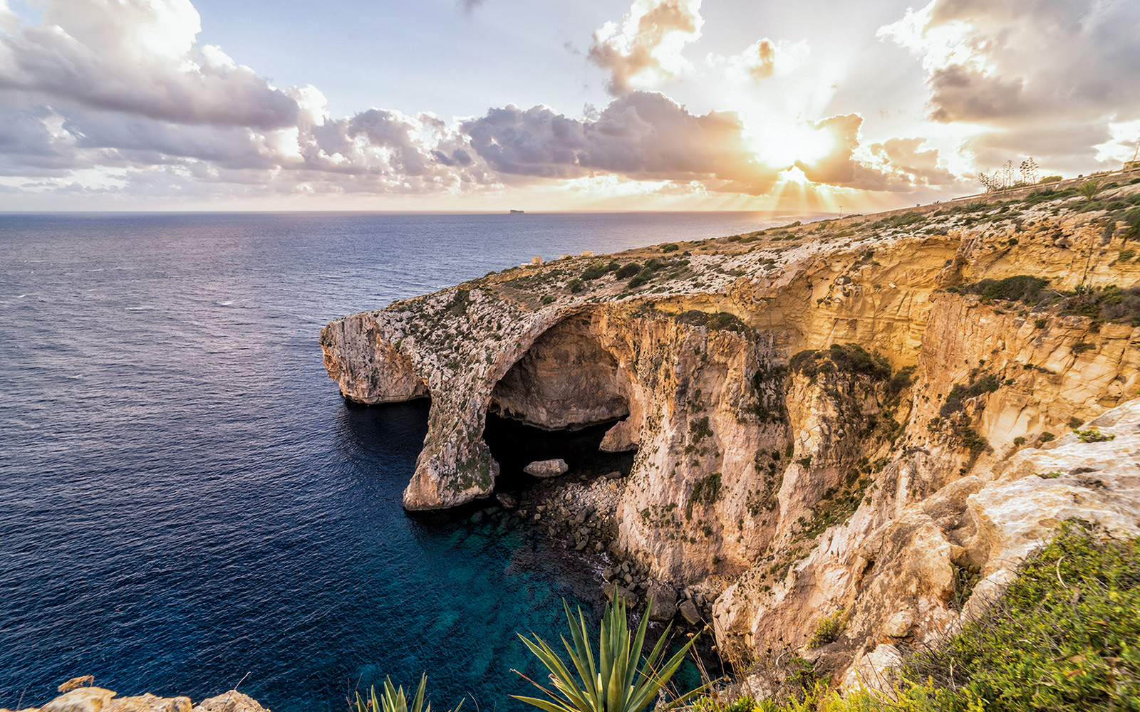 Blue Grotto cliffs and sea view at sunset, Malta.