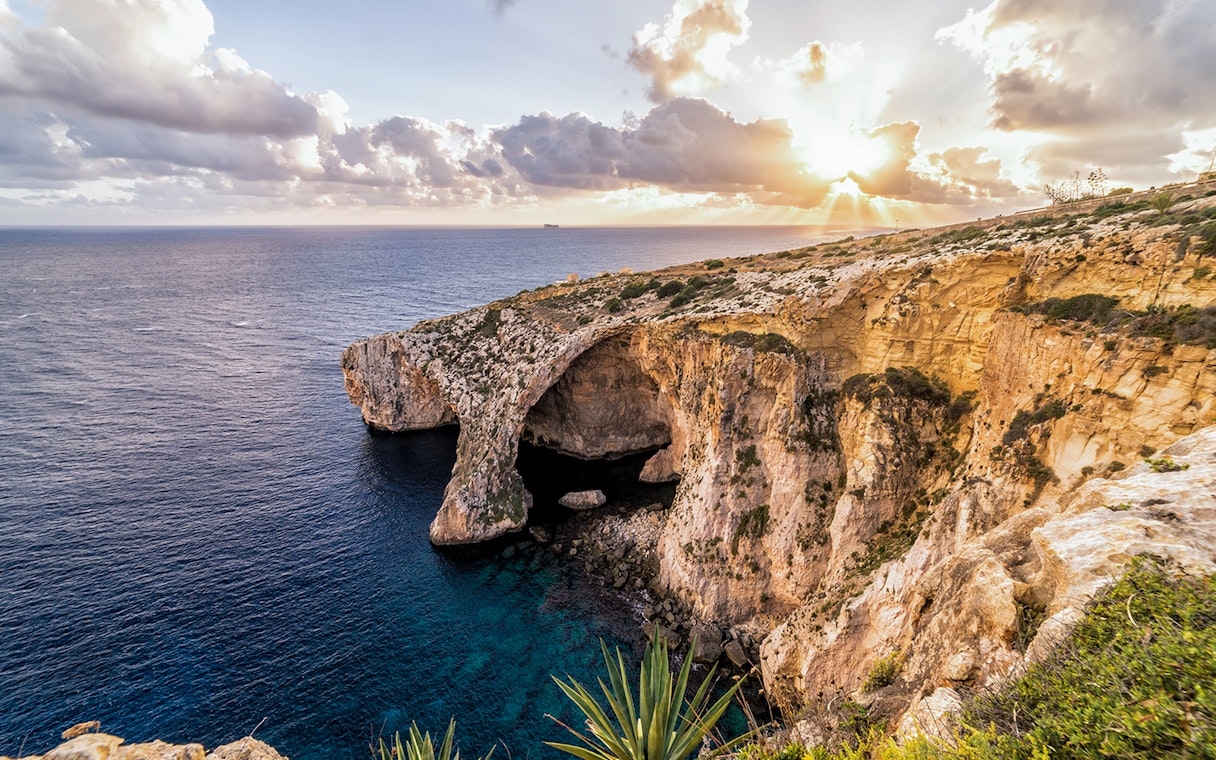 Blue Grotto cliffs and sea view at sunset, Malta.