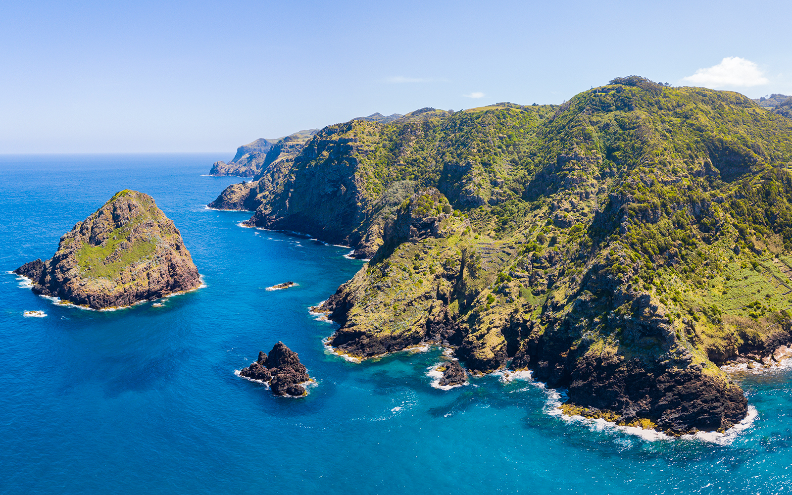 Santa Maria Cliffs in Malta with rugged coastline and clear blue sea.