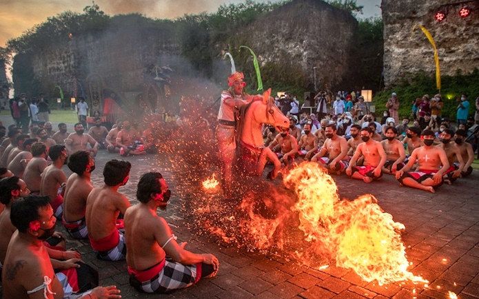 Kecak dance performance with fire at Garuda Wisnu Kencana, Bali.