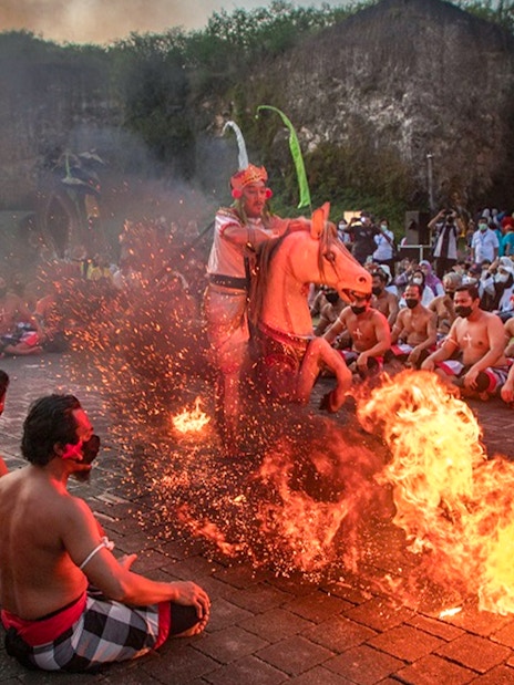 Kecak dance performance with fire at Garuda Wisnu Kencana, Bali.
