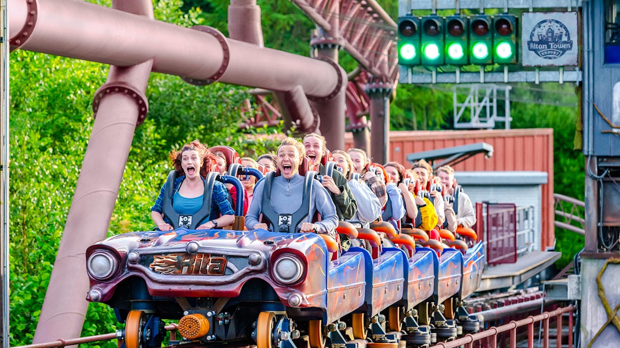 Riders on the Rita rollercoaster at Alton Towers, experiencing high-speed thrills.