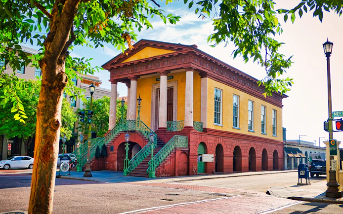Historic Charleston City Market building with columns and stairs in Charleston.