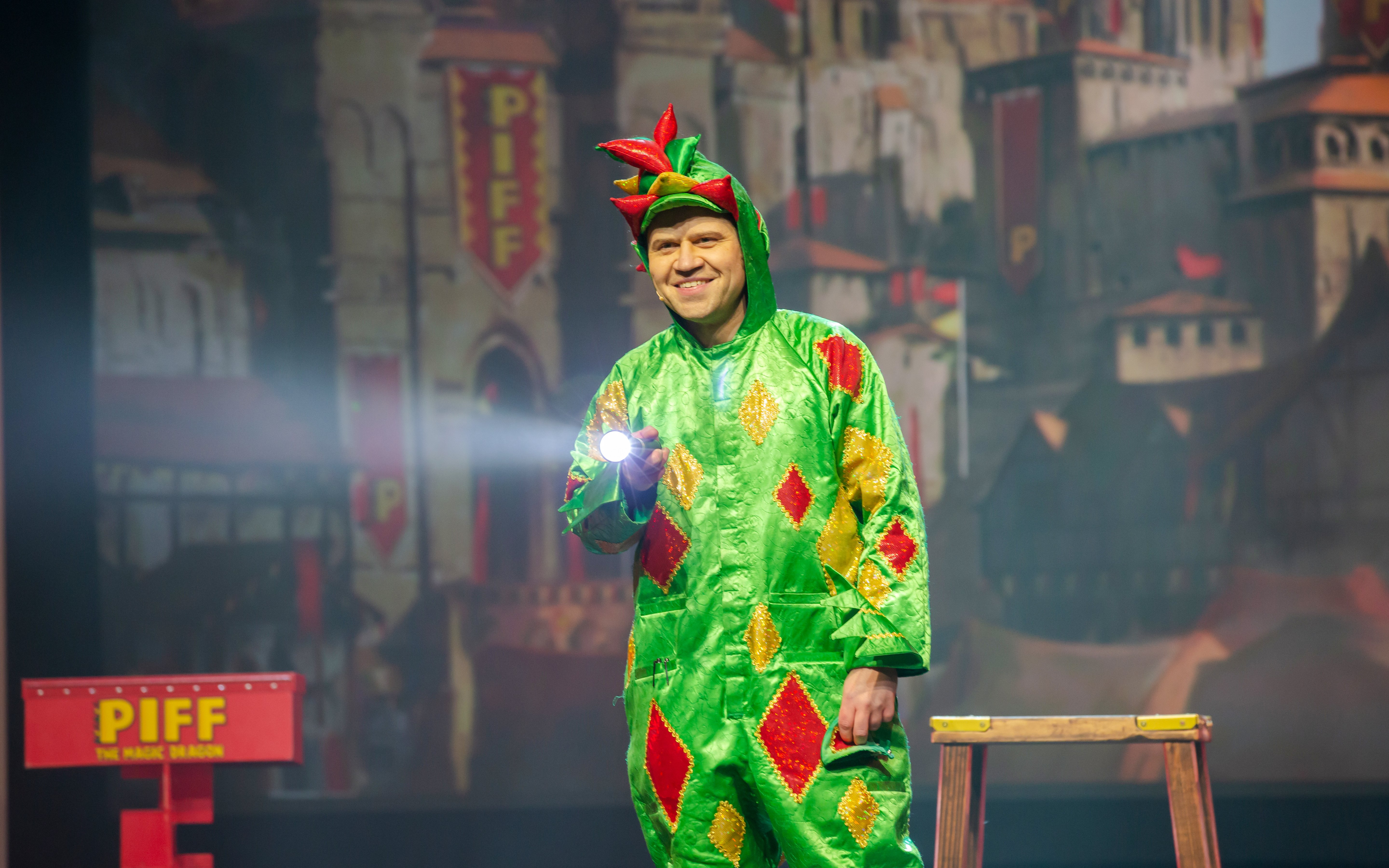 Performer in dragon costume on stage at Piff the Magic Dragon show, Vegas.