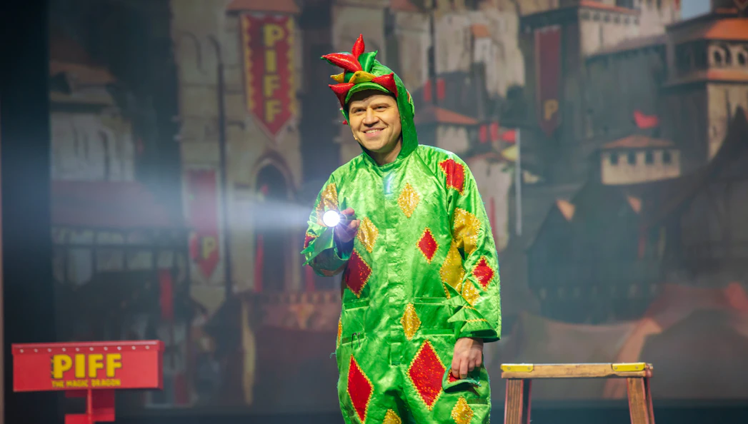 Performer in dragon costume on stage at Piff the Magic Dragon show, Vegas.