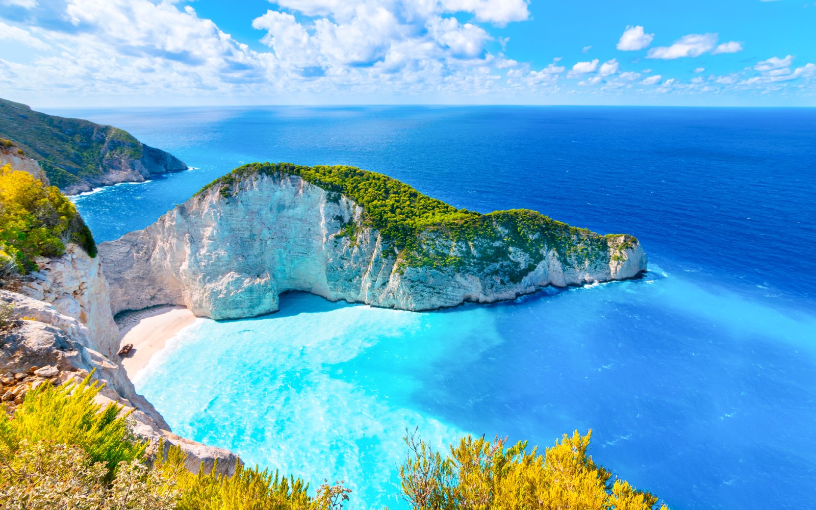 Navagio Beach and Shipwreck Bay viewpoint, Zakynthos, with turquoise waters and cliffs.
