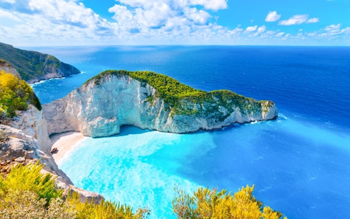 Navagio Beach and Shipwreck Bay viewpoint, Zakynthos, with turquoise waters and cliffs.