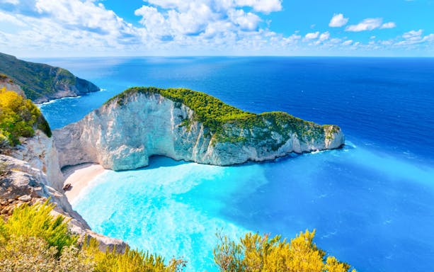 Navagio Beach and Shipwreck Bay viewpoint, Zakynthos, with turquoise waters and cliffs.