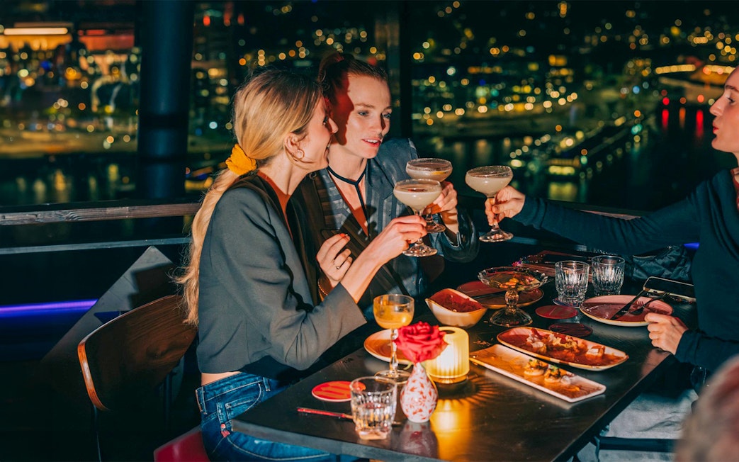 Dining at MADAM skybar with city view, A'DAM LOOKOUT, Amsterdam.