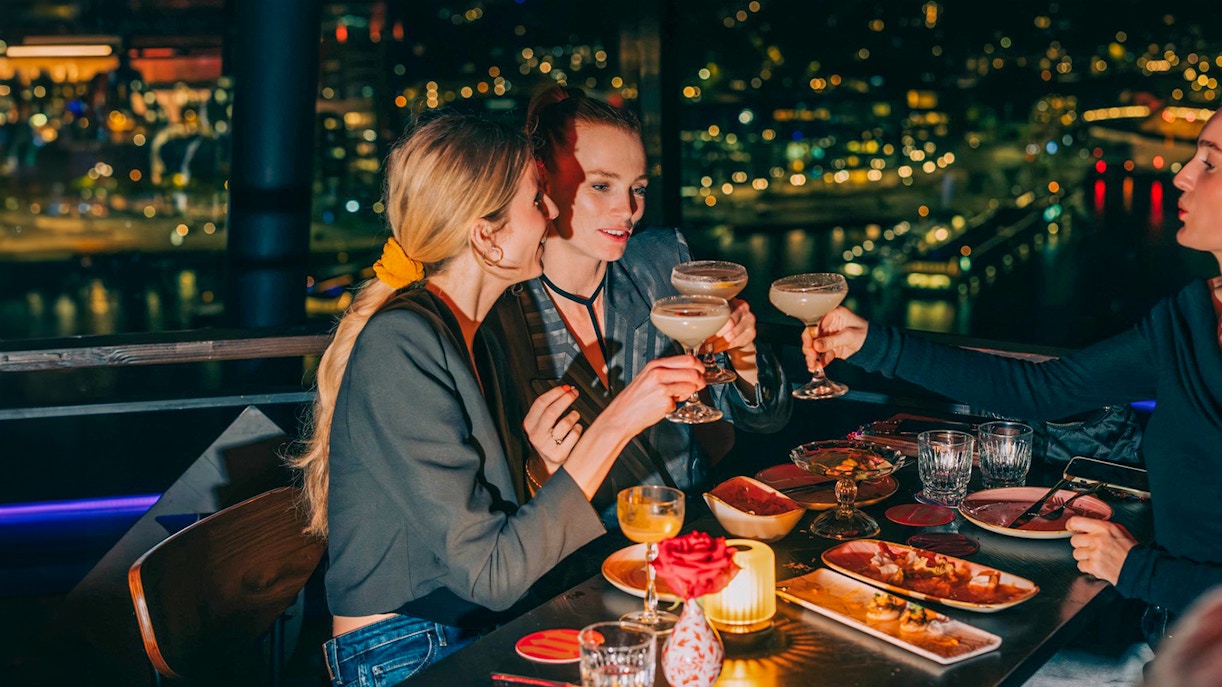 Dining at MADAM skybar with city view, A'DAM LOOKOUT, Amsterdam.