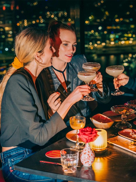 Dining at MADAM skybar with city view, A'DAM LOOKOUT, Amsterdam.