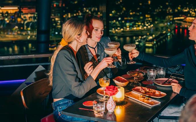 Dining at MADAM skybar with city view, A'DAM LOOKOUT, Amsterdam.