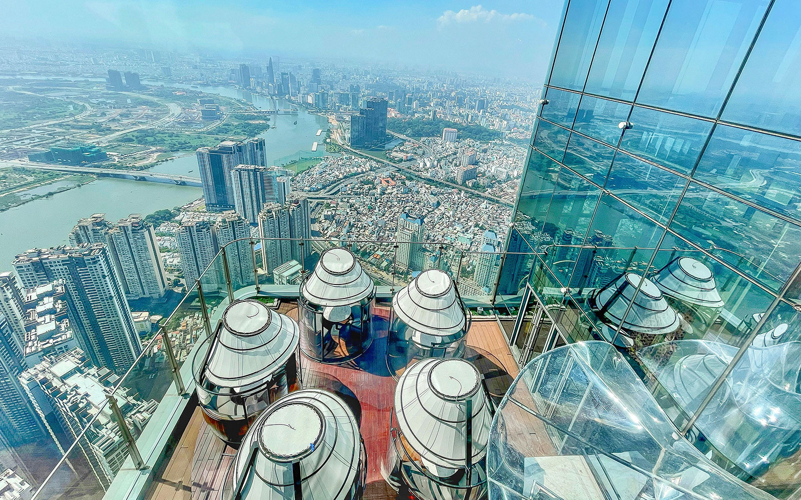 Skyview from Landmark 81 in Saigon overlooking cityscape and river.