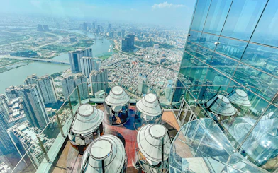 Skyview from Landmark 81 in Saigon overlooking cityscape and river.