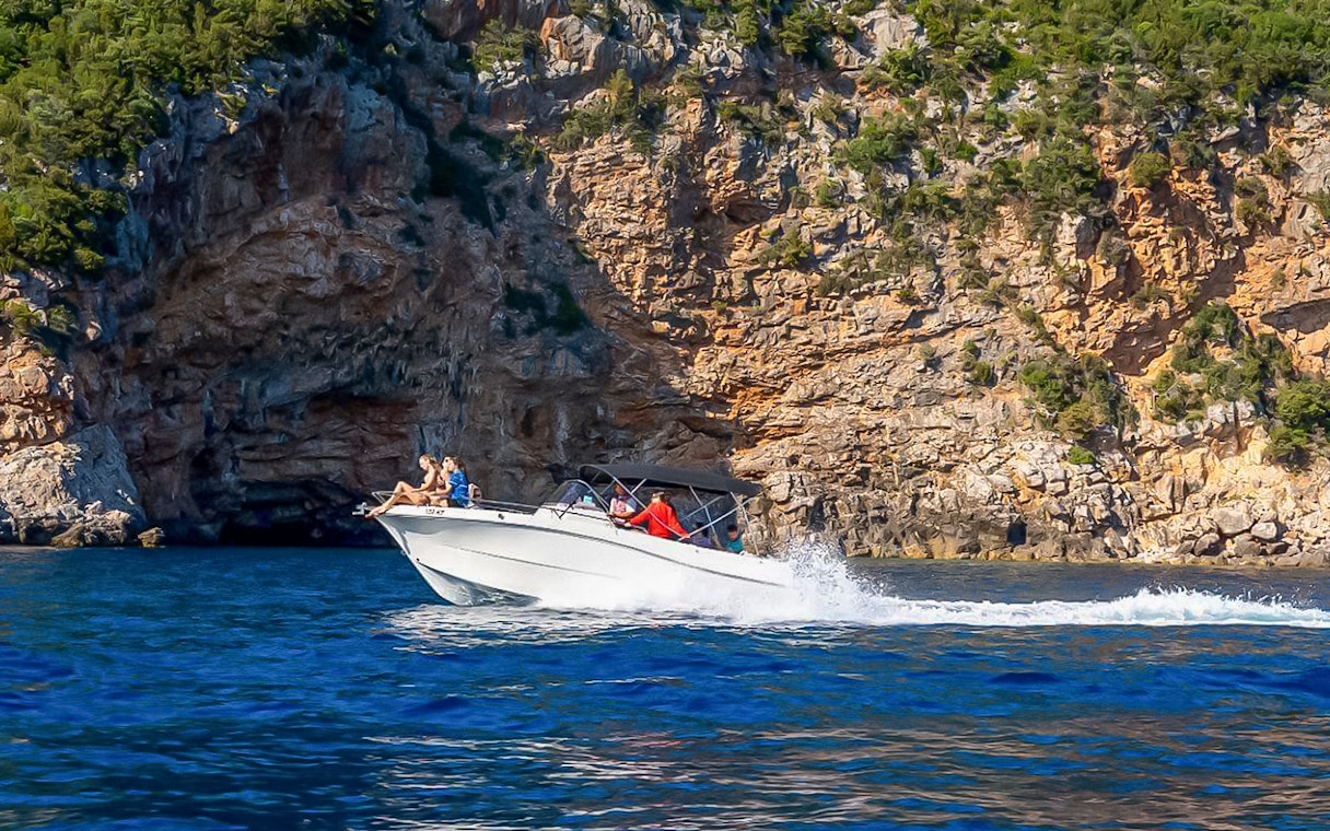 Speedboat approaching the entrance of the Blue Cave in Kotor, Montenegro.
