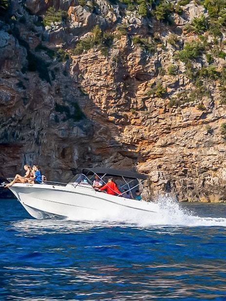 Speedboat approaching the entrance of the Blue Cave in Kotor, Montenegro.