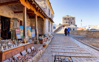 Market stalls with traditional crafts near the Old Bridge in Mostar.