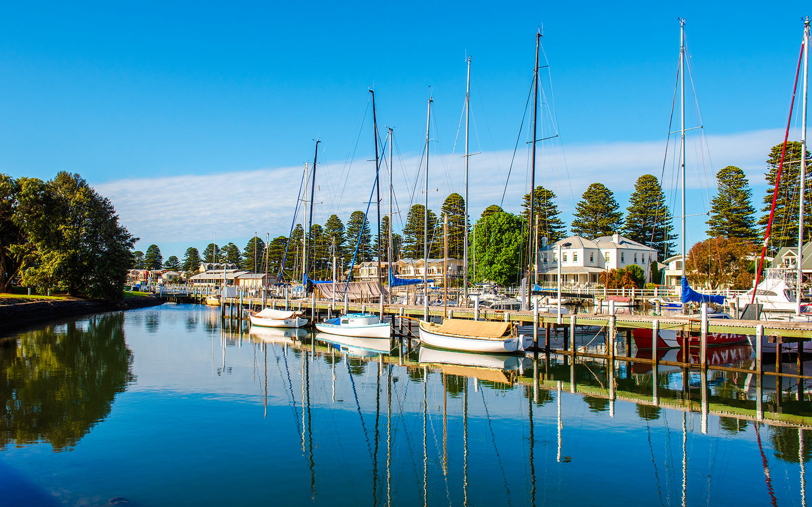 Boats docked along the Moyne River in Port Fairy, showcasing the scenic waterfront.