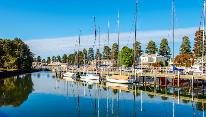 Boats docked along the Moyne River in Port Fairy, showcasing the scenic waterfront.