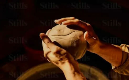 Hands shaping clay at a pottery workshop in Ourika, Marrakesh.