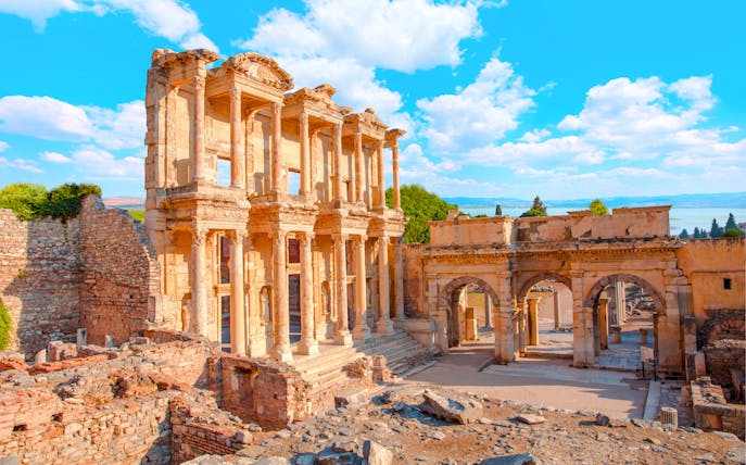 Celsus Library ruins in Ephesus, Turkey, with ancient stone columns and arches.
