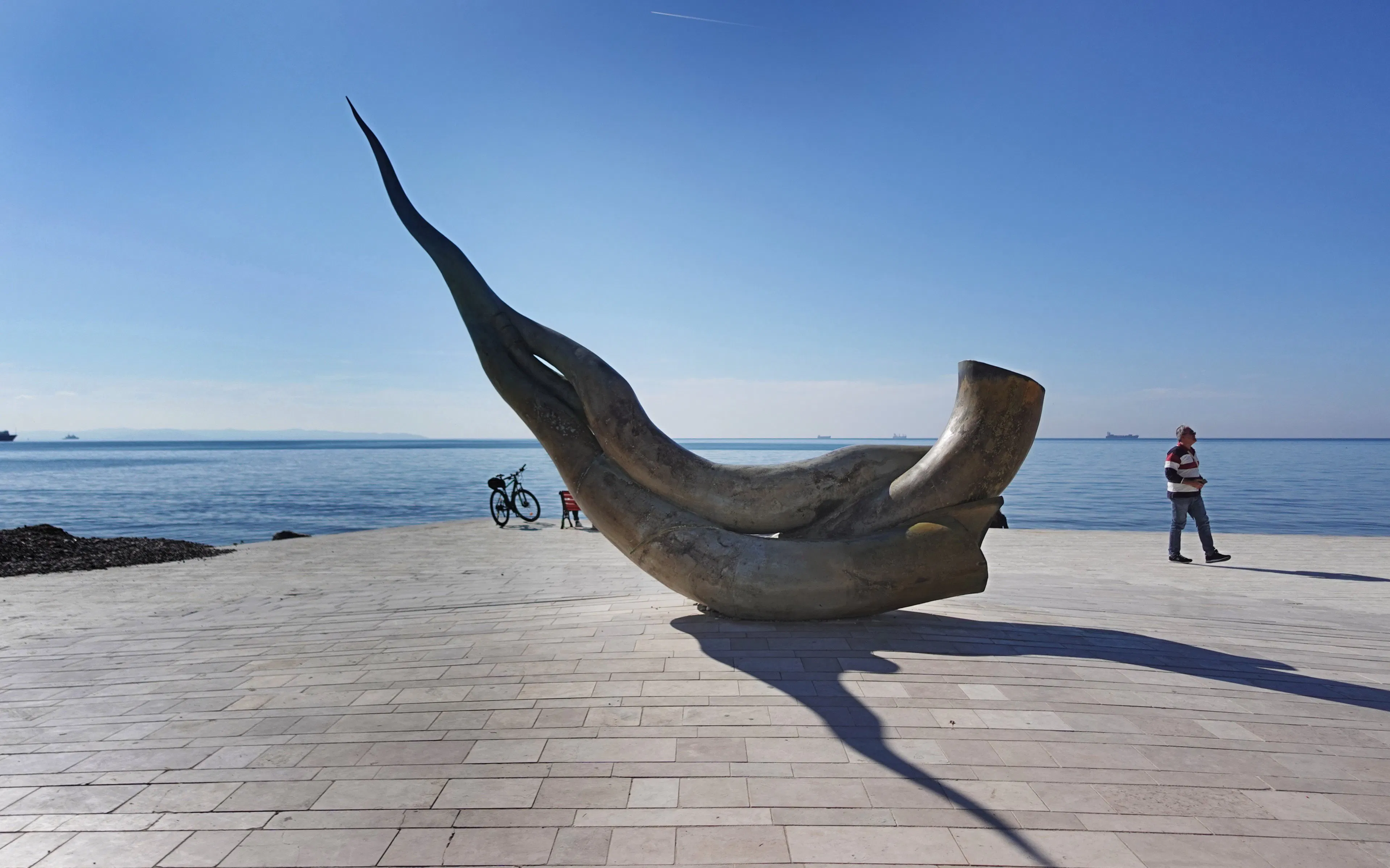 Seashell statue on Durrës beach, Albania with ocean backdrop.