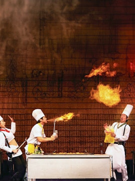 Chefs performing a fire trick on stage during the Nanta Show in Seoul.