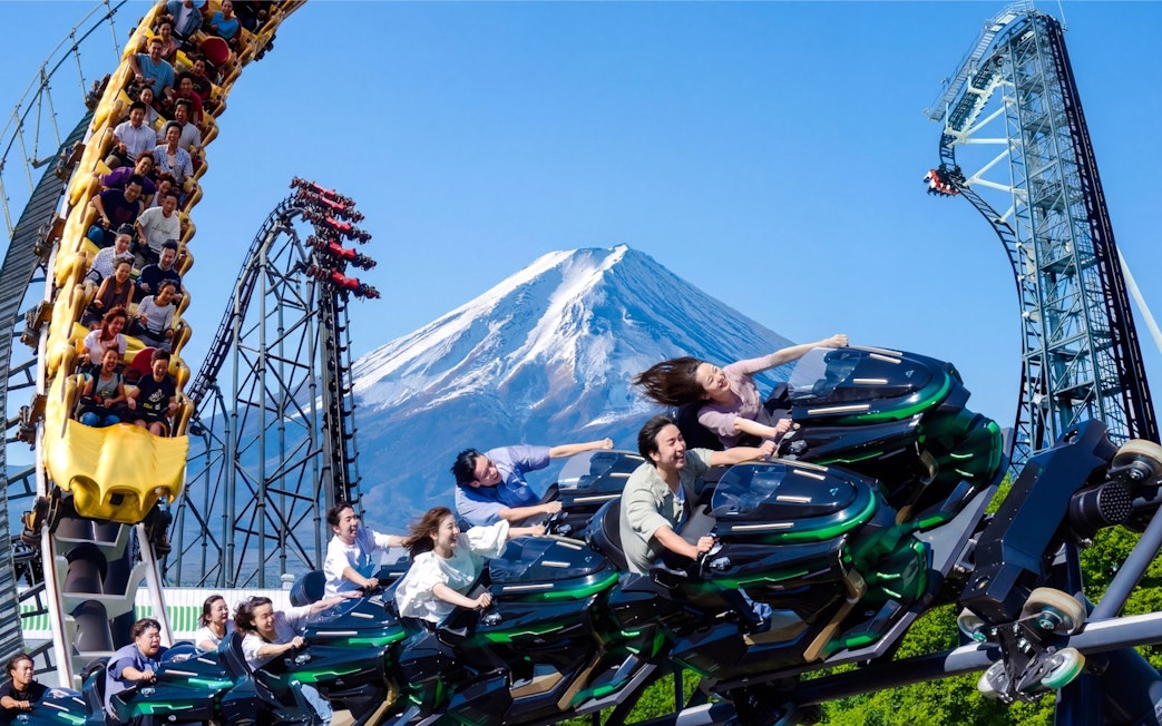 Zokkon roller coaster with Mount Fuji in background at Fuji-Q Highland, Japan.