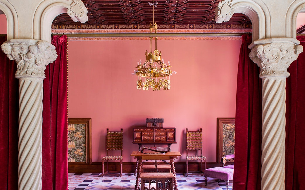 Casa Amatller interior with ornate columns and vintage furniture, Barcelona.