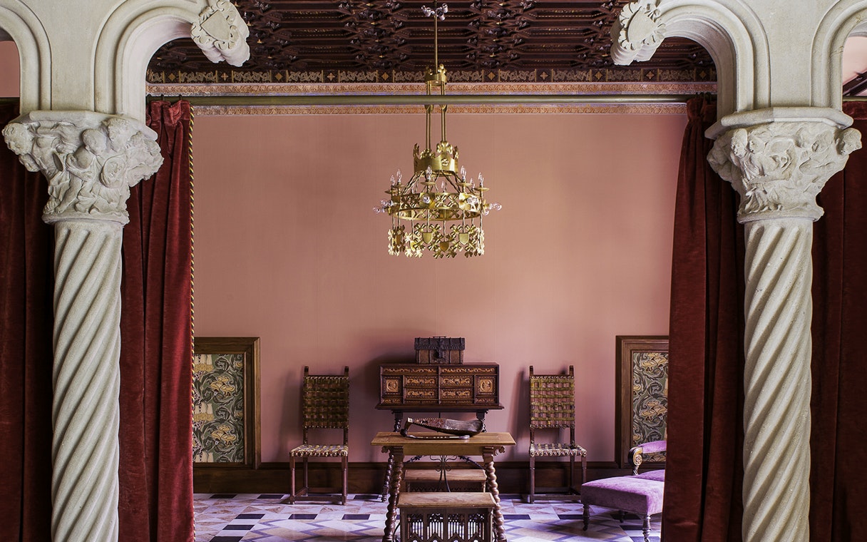 Casa Amatller interior with ornate columns and vintage furniture, Barcelona.