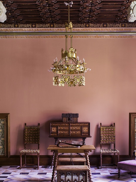 Casa Amatller interior with ornate columns and vintage furniture, Barcelona.