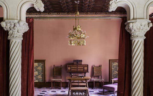 Casa Amatller interior with ornate columns and vintage furniture, Barcelona.