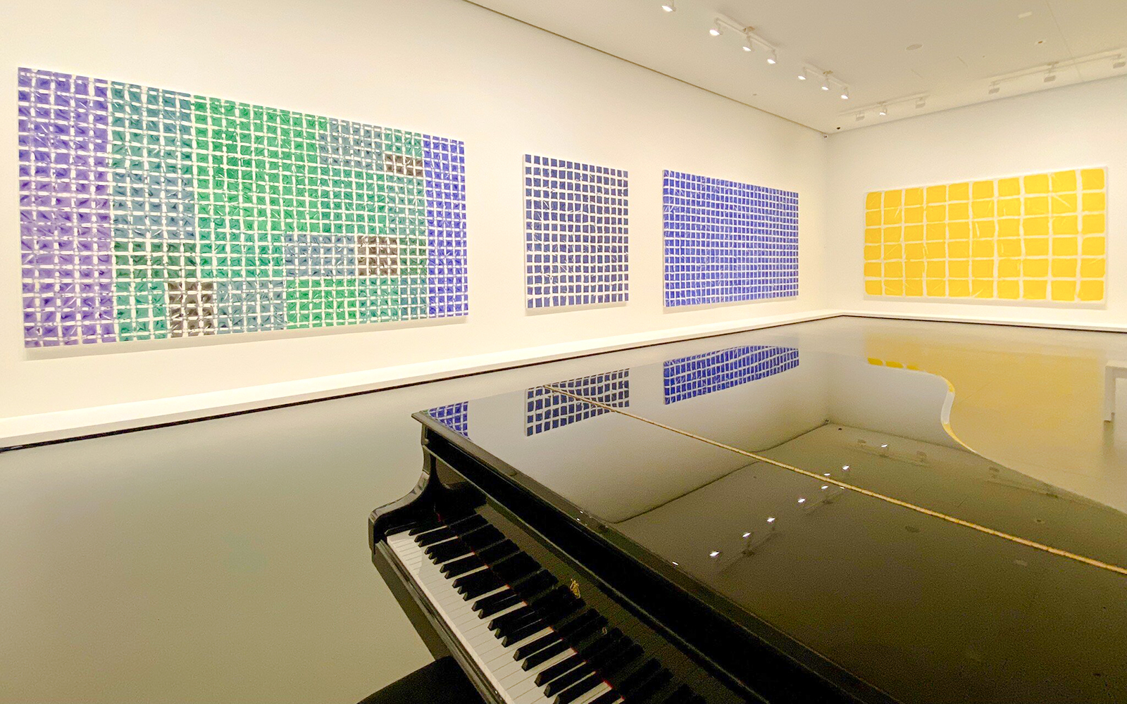 Grand piano and colorful abstract art in Louis Vuitton Foundation, Paris.
