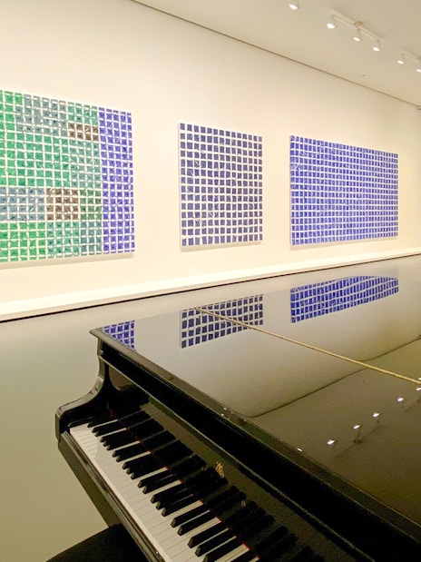 Grand piano and colorful abstract art in Louis Vuitton Foundation, Paris.