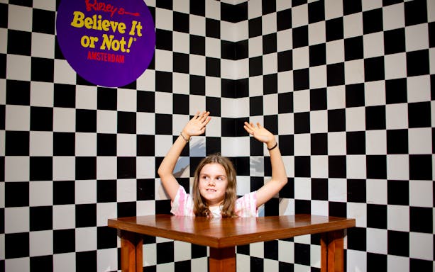 Child in optical illusion exhibit at Ripley's Believe It or Not! Amsterdam.