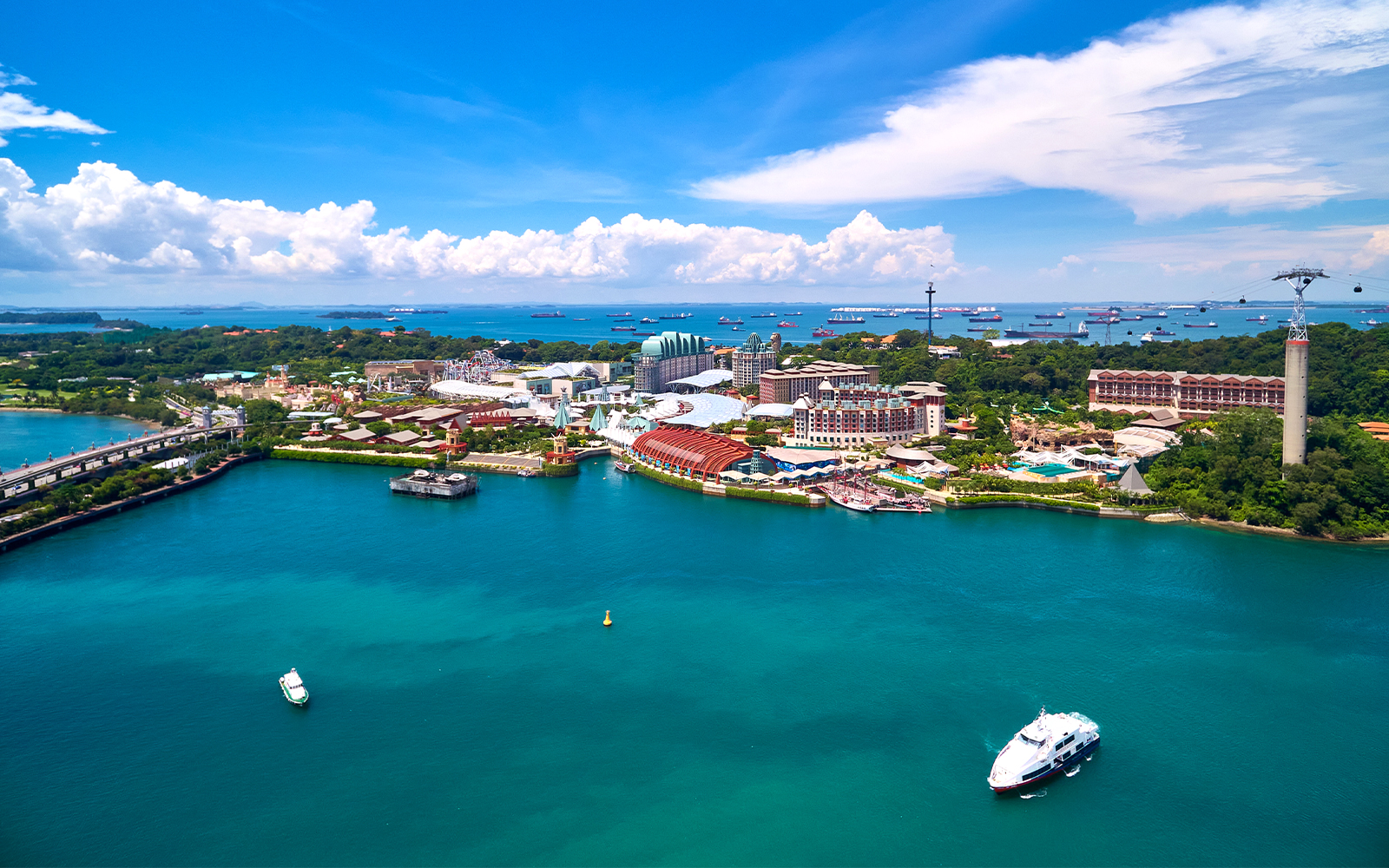 Aerial view of Sentosa Island, Singapore, featuring resorts and waterfront.
