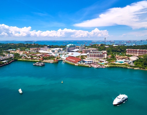 Aerial view of Sentosa Island, Singapore, featuring resorts and waterfront.