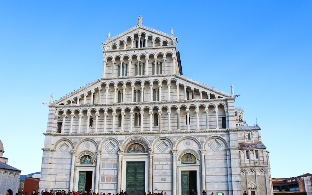 Pisa Cathedral facade with tourists on a 2-hour guided tour.