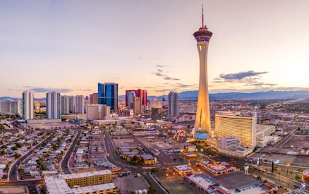 Aerial view of the Las Vegas Strip with Stratosphere Tower at sunset.