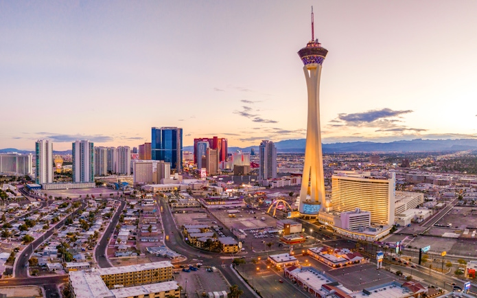 Aerial view of the Las Vegas Strip with Stratosphere Tower at sunset.