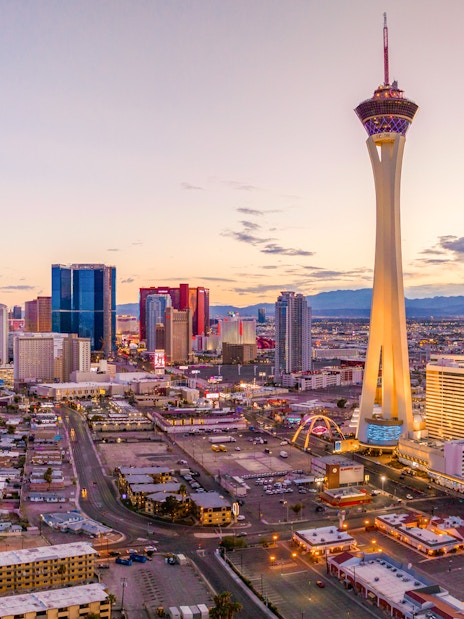 Aerial view of the Las Vegas Strip with Stratosphere Tower at sunset.