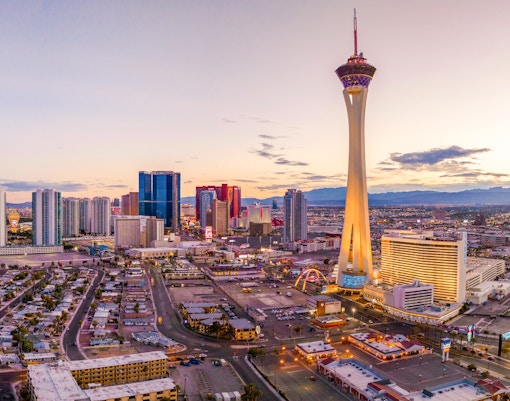 Aerial view of the Las Vegas Strip with Stratosphere Tower at sunset.