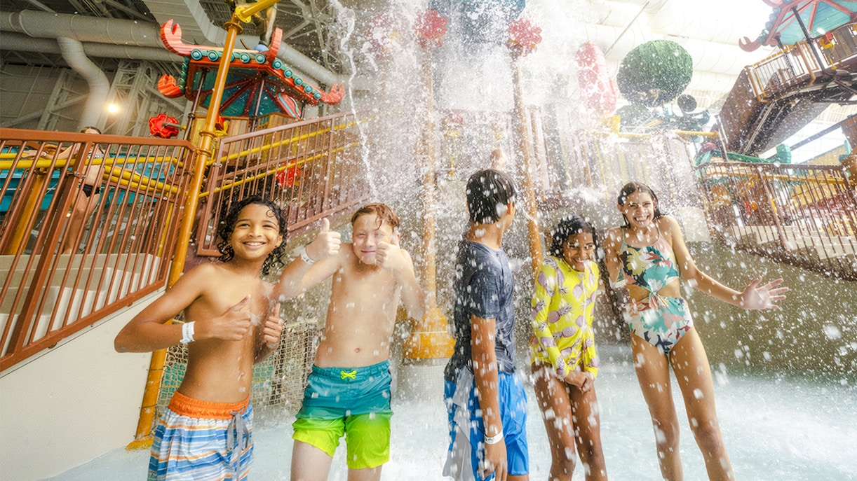 Children enjoying water splash