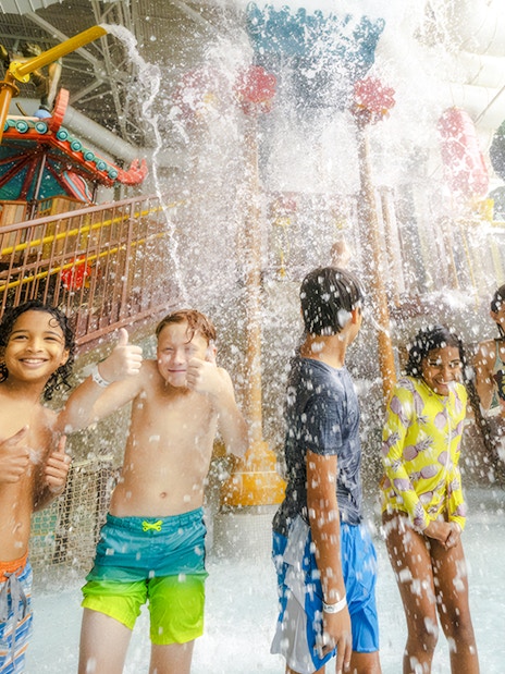 Children enjoying water splash at KingFu Panda Temple of Awesomeness, American Dream Water Park.