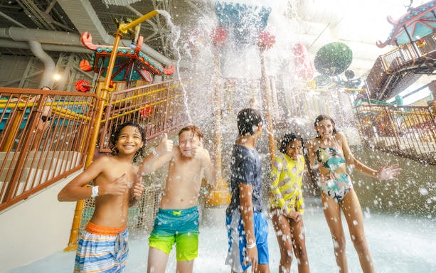 Children enjoying water splash at KingFu Panda Temple of Awesomeness, American Dream Water Park.