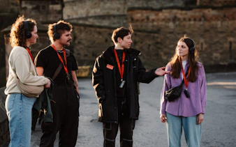 Tour group in Edinburgh discussing the Witches of Edinburgh: Trial and Truth experience.