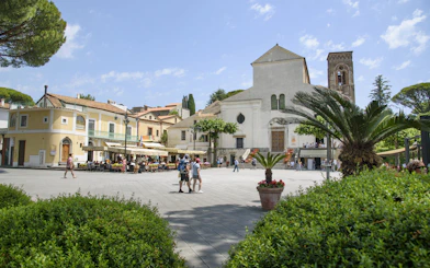 Ravello town square with historic church and outdoor café, part of Amalfi Coast boat tour from Sorrento.