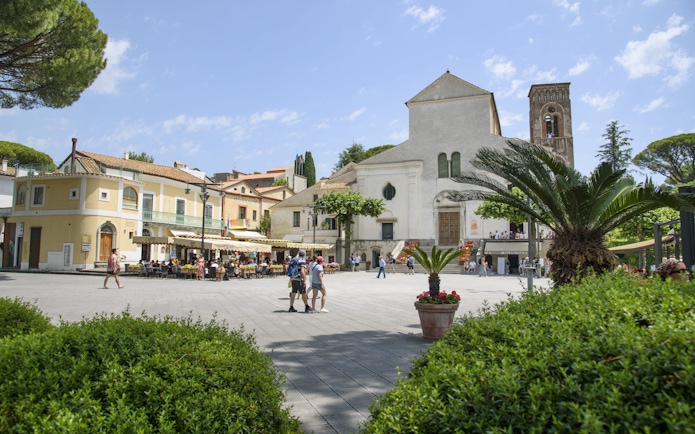 Ravello town square with historic church and outdoor café, part of Amalfi Coast boat tour from Sorrento.