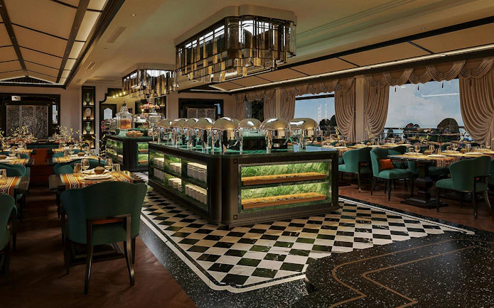 Luxury dining area on La Casta Star Cruise, Lan Ha Bay, with elegant decor and buffet setup.
